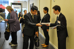 JETAADC Volunteer, Sam Ross, greets guests as they enter JICC.